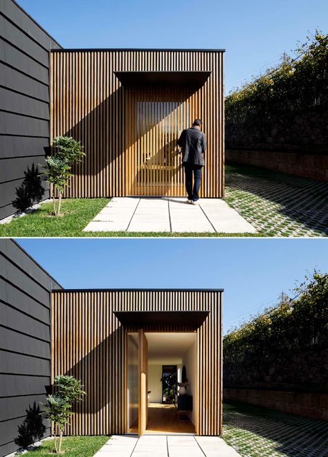 Wood Slats On The Exterior Of This House Hide Some Windows And Doors Wood Slats Exterior, Timber Garage, Window Reveal, Wood Facade, Timber Slats, Wood Slat Wall, House Design Exterior, Exterior Modern, Wood Cladding