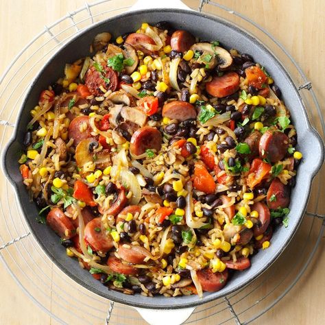 Here's one of my husband's favorite dishes. When it's in season, substitute fresh corn for frozen. Add a dash of cayenne pepper if you like a little heat. —Sheila Gomez, Shawnee, Kansas Kielbasa Skillet, Beans And Vegetables, Kielbasa Recipes, Iron Skillet Recipes, Skillet Dishes, Rice Beans, Cast Iron Skillet Recipes, Skillet Dinners, Cast Iron Recipes