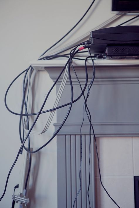 I'm an interior designer - and my simple trick will help you hide all those pesky cables without spending tons of money | The Sun Hiding Wires Mounted Tv, Diy Hide Tv Cords, Hide Cables On Wall, Hide Wires On Wall, Hide Cords On Wall, Tv Cord Cover, Hide Tv Cords, Hide Tv Cables, Tv On The Wall