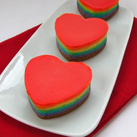 Add a rainbow of colors to to your Valentine's Day Desserts. These multi-colored Rainbow Cheesecake Hearts taste as great as they look. Rainbow Cheesecake, Heart Desserts, Rainbow Cookie, Valentines Breakfast, Heart Shaped Food, Frozen Cheesecake, Individual Desserts, How To Make Cheesecake, Heart Shaped Cakes