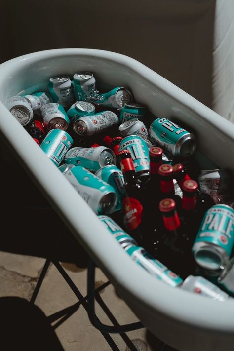 This shows a close up of a white enamel bath filled with iced water and alcohol Welcome Drink Station, Iced Water, Drink Display, Barrel Bar, Bar Display, Event Bar, Drinks Trolley, Classic Bar, Bar Displays