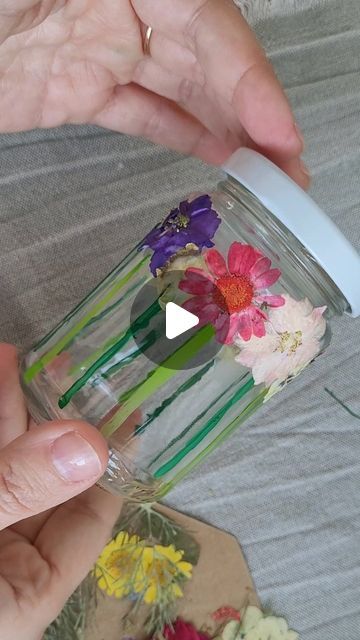 DIY - Basteln mit Kindern on Instagram: "I've just realized that I haven't shown you yet the flower meadow glass I've created for my daughter...🌞. She too created some glasses as a storage to her jewelry! Super easy to do, you only need acrylic paint, a mason jar and pressed flowers 🥰 Another fantastic meadow idea is from @skoy_me who inspired me! #flowercrafts  #diyreels  #naturecrafts  #masonjarideas  #craftreels  #makecreateplay  #ministylemag" Flower Meadow, For My Daughter, Nature Crafts, Flower Crafts, Pressed Flowers, Mason Jar, My Daughter, Flower Vases, Acrylic Paint