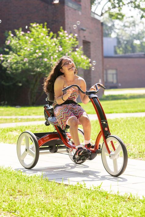 A girl rides a red Rifton Adaptive Tricycle. Improve Physical Health, Adaptive Bikes, Adapted Physical Education, School Based Therapy, Gait Training, Walking Support, Adaptive Equipment, Occupational Therapy, Kids Health