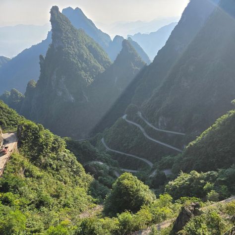 Tianmen Shan: The Gateway to Heaven. Tianmen Shan, or Tianmen Mountain, is one of China’s most breathtaking natural wonders, located near Zhangjiajie in Hunan Province. Known for its dramatic landscapes, towering cliffs, and the iconic natural arch, Heaven’s Gate (Tianmen Cave), the mountain offers both serene beauty and thrilling adventure. One of the most exciting events here is the Land Rover Challenge, where professional drivers push their vehicles to the limit on the famous 99-bend r... Rover Challenge, China Mountains, Gateway To Heaven, Tianmen Mountain, Zhangjiajie, Changsha, To Heaven, Natural Wonders, The Land