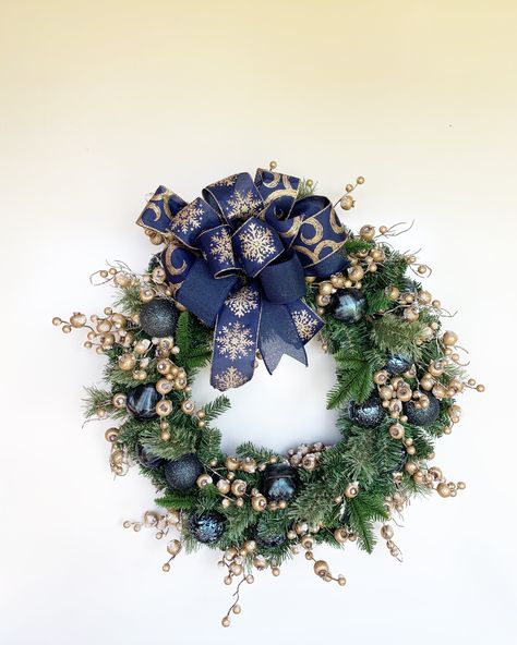 Navy & Gold Christmas Wreath with gold berries and blue ornaments, holiday wreath, winter decor, front door wreath, holiday decor. evergreen Blue And Gold Christmas Wreath, Navy Gold Christmas, Brown Christmas Decorations, Frosted Berries, Gold Christmas Wreath, Large Cardboard Boxes, Blue Ornaments, Navy Ribbon, Evergreen Wreath