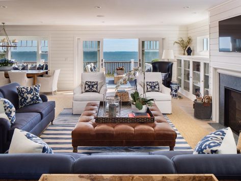 Blue and White Coastal Living Room With Leather Ottoman The mood in the home's main living areas is open and friendly, with easy access to ocean view decks and a fireplace to gather round when nights chill off. Coastal Living Room Furniture, Beach Home Interiors, Best Leather Sofa, Beach House Living Room, Beach House Interior Design, Tropical Home Decor, Coastal Living Rooms, Ideas Hogar, Beach House Interior