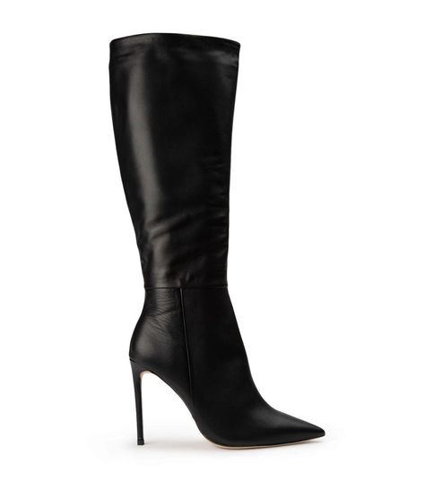 Keep it extra chic with the classic Apollo black leather knee-high boots. Featuring an elongated pointed toe design, a high stiletto heel and a full length zip, this calf boot transcends trends and remains a timeless staple. -Material: Leather -Sole: Man-made -Fit: True to size -Toe-shape: Pointed -Features: Stiletto Heel -Leg Height: 39cm -Heel: 10.5cm Leg Height x Calf Circumference x Opening Circumference 5 – 372mm x 282mm x 300mm 5.5 -376.5mm x 286.5mm x 305mm 6 – 381mm x 291mm x 310mm 6.5 – Knee High Black Boots, Thigh High Boots Flat, Shop Boots Online, Black Leather Knee High Boots, Shop Boots, Embellished Heels, Metallic Shoes, Tony Bianco, Stiletto Boots