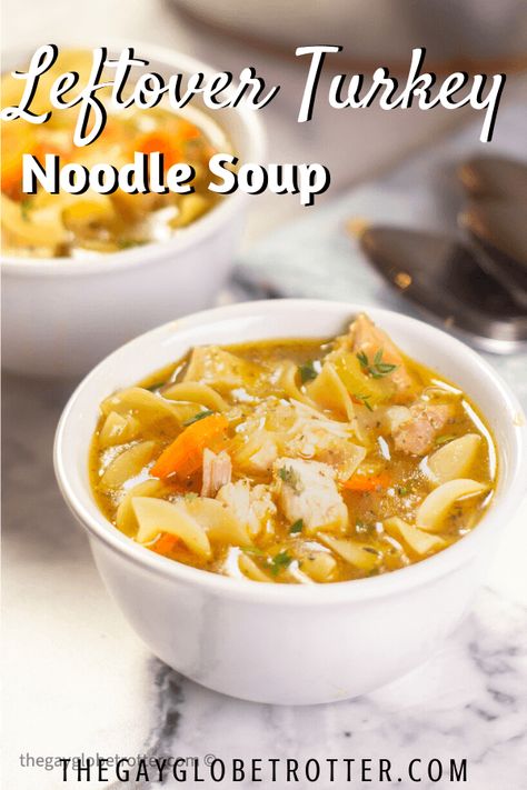 This leftover turkey noodle soup recipe uses egg noodles, homemade turkey stock made from a turkey carcass, and turkey meat for a hearty turkey soup recipe for winter! #gayglobetrotter #turkey #soup #turkeysoup #turkeynoodlesoup #souprecipe Turkey Soup With Egg Noodles, Turkey Egg Noodle Soup, Turkey Carcus Soup Recipes, Turkey Carcass Soup Recipes, Turkey Noodle Soup From Carcass Recipes, Turkey Broth Soup, Turkey Noodle Soup Homemade, Turkey Soup Recipes Homemade, Turkey Soup From Carcass Recipes