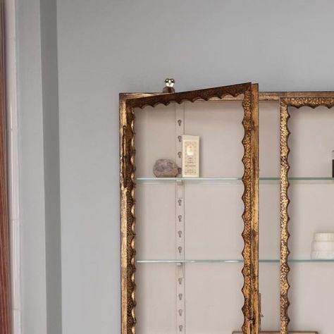 Georgie Stogdon on Instagram: "A bathroom completed last year with a huge 20thC Italian gilt metal cupboard from @brownrigguk hanging next to a shower curtain made with @rosetarlowmelrosehouse ‘Tristan roux’ linen. I’ll always opt for a shower curtain over glass, attaching the plastic lining to a secondary fabric.  #interiordesign #bathroomdesign" Katie Cardew, Metal Cupboard, British Slang Words, Midas Touch, Cubbies, Architecture House, Cupboard, Instagram A, Bathroom Design