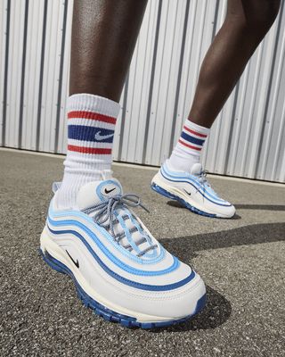 Sleek. Stylish. Simple. The Air Max 97's water-inspired design flows whether you're out for a run or a night on the town. Full-length Nike Air cushioning lets you ride in performance comfort. Shown: Summit White/Court Blue/Light Photo Blue/Black Style: FN6957-100 Air Max 97s, Light Photo, Nike Air Max 97, Black Style, Blue Light, Air Max, Nike Air Max, Black Fashion, Blue Black