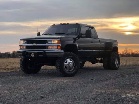 Badass 90’s model Chevrolet K3500 Ext Cab Dually lifted with a Cummins power plant under the hood! Obs Chevy Dually, K3500 Dually, Chevy 3500 Dually, Lifted Dually Trucks, Chevy Dually, Obs Chevy, Chevy Vehicles, Chevy Trucks Silverado, Lowrider Trucks