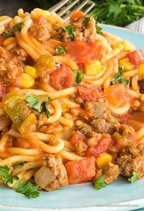 Our Easy Mexican Spaghetti Recipe is a delicious One Pot wonder! Filled with beef, pasta, tomatoes, corn and taco seasoning, this is a meal the whole family will love! Its also finished with a cheesy topping. Mexican Spaghetti is perfect for a busy weeknight dinner. Mexican Cream Sauce, Cream Sauce For Pasta, Mexican Spaghetti, Sauce For Pasta, Taco Spaghetti, Easy Mexican, Spaghetti Recipes, Spaghetti Squash, Mexican Dishes