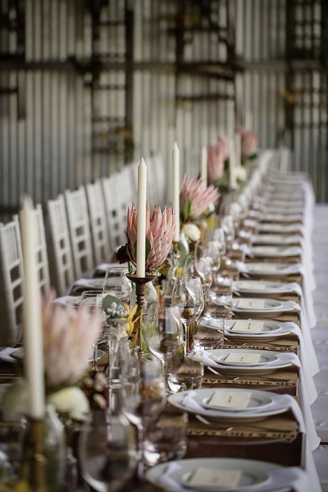 Protea Table Setting, Country Wedding Place Settings, Protea Wedding Table Decor South Africa, Protea Table Decor, Protea Wedding Decor, Protea Wedding Table Decor, Shed Wedding Reception, Protea Flower Wedding, Protea Wedding Flowers