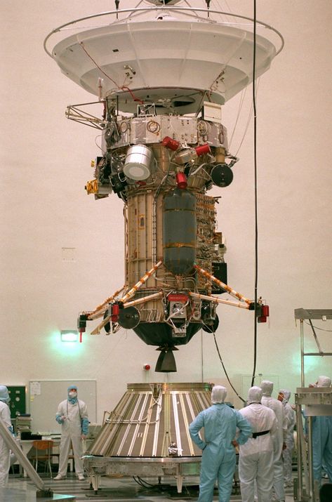 FILE – In this Friday Sept. 20, 1996 file photo, NASA’s Jet Propulsion Laboratory engineers and technicians lower the 3,420-pound Cassini Spacecraft into the Launch-Vehicle-Adapter at JPL in Pasadena, Calif. After a 20-year voyage, the spacecraft is poised to dive into Saturn on Friday, Sept. 15, 2016. (AP Photo/Frank Wiese) Cassini Spacecraft, Aerospace Design, Space Probe, Visual Library, Space Engineers, Major Tom, Aerospace Engineering, Spaceship Art, Space Pictures