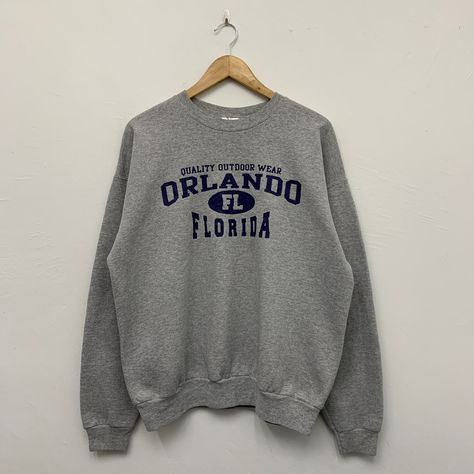 ">> Vintage Orlando Florida Sweatshirt ** Size : Large  ** Measurement on laid flat :  >> Armpit : 24\" >> Shoulder to bottom : 26.5\" >> Length sleeve from collar : 31\" ** Great used condition. ** A few stains spotted. ** Overall condition is 7/10. ** Weight : 400g >> Please refer and enlarge pictures for clear view. >> All sales are FINAL and Sold As Is** #SW-14" Usa Sweater, University Sweatshirts, Vintage Crewneck, Half Zip Sweatshirt, Sweatshirt Shirt, 로고 디자인, Outdoor Wear, Orlando Florida, Zip Sweatshirt