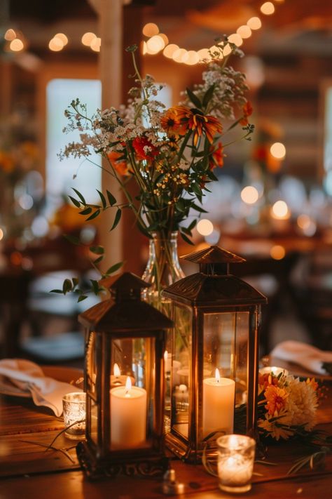 Enhance the warmth and romance of your wedding tables with candle centerpieces. Click for more ideas. Lanterns At Wedding, Simple Lantern Centerpieces, Eucalyptus Candle Centerpiece, Wedding Decor Lanterns, Beachy Centerpieces, Lantern Wedding Decor, Rustic Lantern Centerpieces, Nye Decor, Wedding Centerpieces Rustic