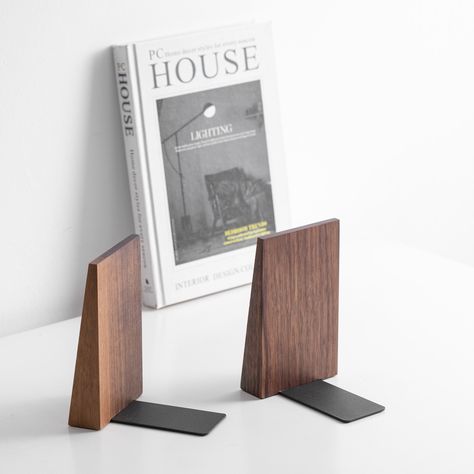 Simple and elegant! 🎉 The retro feel of this bookend makes it look like a fine piece of art just when placed in the bedroom. The black walnut scent and natural wood texture add a touch of nature to your room.💡And the depth of color and texture of each pair of wooden bookends is unique. 📏Dimension : 15.3*9.3cm 🔨Material : black Walnut #woodenbookends #bookends #organizeyourbooks #luxuryhomeaccessories #booklovergifts #walnut #walnutwood #woodworkingartistry #study #officedecor #officedesign Simple Bookends, Trophy Case, Wood Bookends, Wooden Bookends, Natural Wood Texture, Color And Texture, In The Bedroom, Piece Of Art, The Bedroom