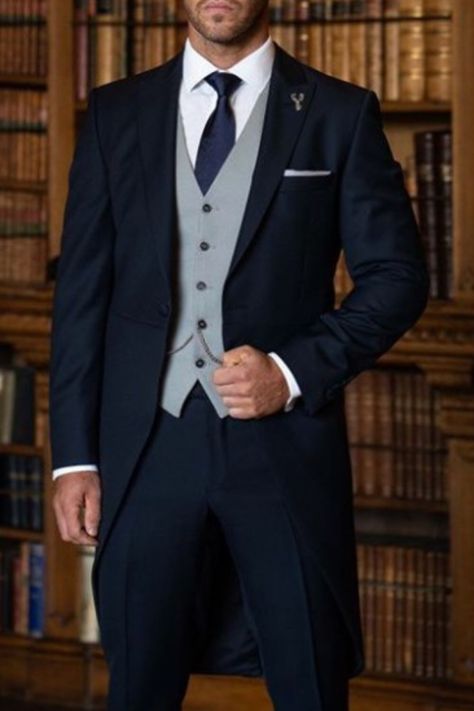 Man wearing a navy suit. Navy Suit Contrast Waistcoat, Blue Suit With Grey Vest, Royal Blue Groom Suit, Groom And Groomsmen Attire Navy, Blue Suit Grey Waistcoat, Gatsby Attire, Wedding Suit Ideas, Navy Wedding Suit, Wedding Morning Suits