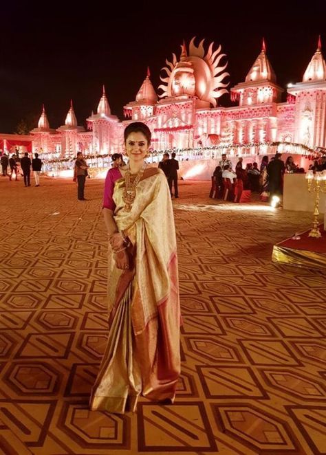 Pooja Patnaik outdazzles her backdrop in a cream Kanchipuram silk saree with maroon border and maroon pallu with gold zari brocade. This beauty, with silver and gold paisley motifs framed in an intricate zari cage, was part of her wedding wardrobe seven years ago, bought at Kankatala's flagship Vizag store. All Pooja's Kanchipuram sarees are from Kankatala, and "Mallik Uncle", Chairman of Kankatala, whom Pooja admires a lot, helped her pick this beauty! Thank you, Pooja, for your loyal clientele Cream Saree, Maroon Saree, Wedding Wardrobe, Saree Kuchu Designs, Kora Silk Sarees, Gold Paisley, Saree Trends, Kanchipuram Silk Saree, Kanchipuram Saree