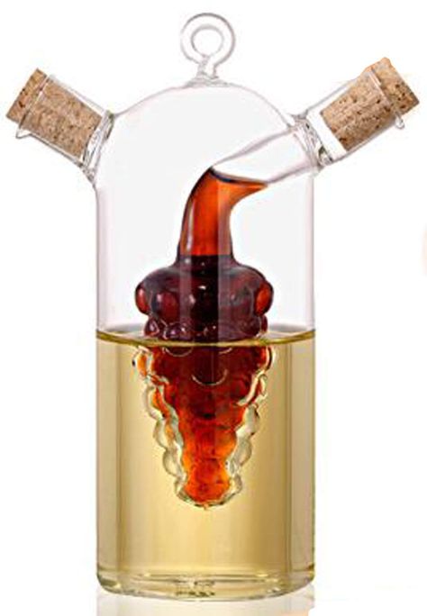 PRICES MAY VARY. temperature resistant Borocilicate glass Imported Measures 6/16cm Tall. Very useful for oil and vinegar. Inner capacity (grape chamber): 2 fl. oz. Outer capacity (oil chamber in image): 8 fl oz. Dripless spouts with corks,Non dropping pouring system to prevent unnecessary spills. Crafted of handblown glass,temperature resistant Borocilicate glass; Oil and Vinegar Cruet features. Modern design,This Grape Oil/Vinegar Cruet Is Ideal. Perfect For Storing And Serving Oil And Vinegar Oil And Vinegar Dispensers, Grape Oil, Hydrogen Peroxide Uses, Vinegar Dispenser, Vinegar Cruet, Olive Oil Dispenser, Olive Oil And Vinegar, Olive Oil Bottles, Oil Dispenser