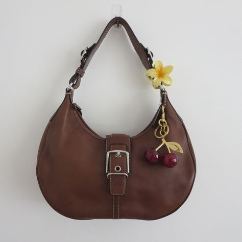 🐻 Y2k 2003 Brown Leather Coach Hamptons Hobo Bag🐻 ⋆ Free US shipping ⋆ 12" x 8" ⋆ good condition ⋆ great condition, stains on back shown ⋆ $145 shipped ⋆ Comment "sold" or dm me to purchase ⋆ Charms included #y2k #2000s #vintagebag #thrift #vintagecoach #vintage #fallinspo #pinterest #fallaesthetic