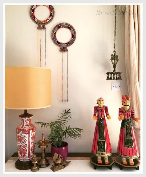 (This lovely corner features  traditional brass South-Indian artifacts, Maasai Tribal Wedding Necklace from Kenya and Rajasthani hand painted wooden figurines.) Beautiful Corners In The House, Rajasthani Home Decor Ideas, Rajasthani Decoration Ideas For Home, Indian Artifacts For Home Decor, Indian Brass Decor Ideas, Artifacts For Home Decor, Rajasthani Home Decor, South Indian Home Decor, Brass Decor Indian Pooja Room