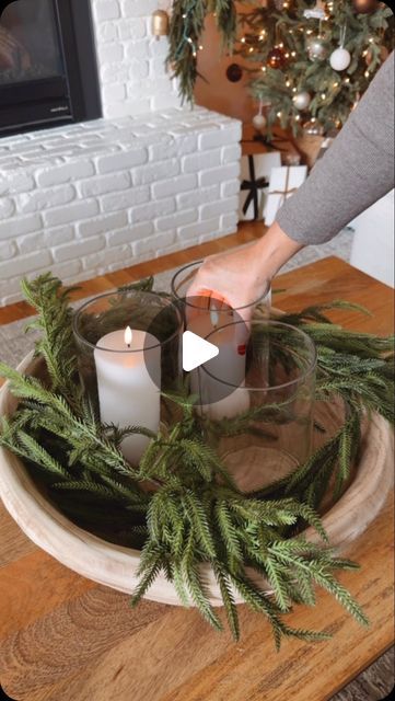 Kaari Sommer on Instagram: "Simple centerpiece styling idea✨!

comment SHOP and I’ll send you a link. 

This centerpiece idea is perfect for a coffee table or dining room table. And it’s super simple!

Here’s how to create it:
Oversized bowl
Garland
Hurricane candle holders
Flameless candles

#christmas2024 #christmasdecor #holidaydecor" Candle Bowl Centerpieces, Kitchen Island Centerpiece, Winter Tray, Simple Centerpiece, Dining Room Simple, Window Table, Greenery Centerpiece, Fake Candles, Christmas Tray