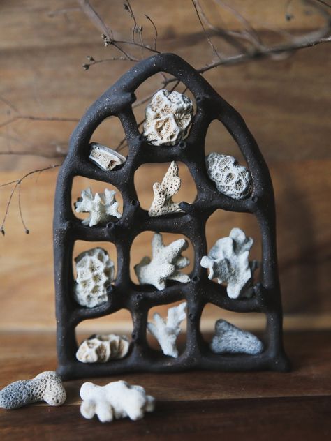 Hand-sculpted black clay curiosity cabinet. This shelf combines architectural elements of high gothic windows with biomorphic shapes inspired by the mollusk eyes. It is intended for displaying small objects measuring below 1 inch in the largest dimension. The listing price is for the ceramic shelf and does not include corals and other display items shown in the photos. The shelf was made in a small smoke-free studio in the middle of Brittany, France. The design is unique and absolutely one-of-a- Interactive Ceramic Art, Ceramic Shadow Boxes, Ceramic Houses Ideas, Ceramics Room, Weird Ceramics, Ceramic Shelves, Clay Shelf, Office Altar, Ceramic Architecture