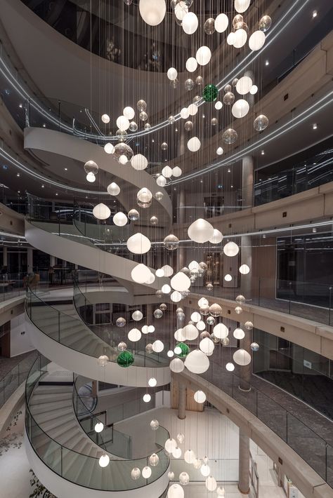 An interactive lighting installation that sparkles and surprises. 🌟 This bespoke Preciosa Lighting installation consist of 226 hand-blown crystal spheres representing the bank’s branches. ✨
We used modern technologies as a welcome and a thank you to employees and customers. 

🤍 What do you think about the atrium of Credit Agricole’s regional headquarters in Clermont-Ferrand, France? Atrium Lighting Design, Atrium Chandelier, Atrium Lighting, Hotel Penthouse, Interactive Lighting, Atrium Design, Orb Light, Lighting Installation, Large Pendant Lighting