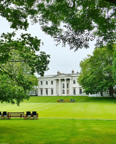 ⛳ 🎩 Obsessed with the façade of the Hurlingham Club House in London. It's such an elegant display of neoclassical architecture, characterized by symmetrical design and refined details. The building exudes an air of timeless sophistication, featuring a grand portico with tall, stately columns that support a classic pediment. The brickwork is complemented by large sash windows, each framed with decorative stone lintels and sills, allowing ample natural light to flood the interiors. An ico... Hurlingham Club, House In London, Neoclassical Architecture, Symmetrical Design, London Christmas, Sash Windows, Brickwork, Stone Decor, Neoclassical