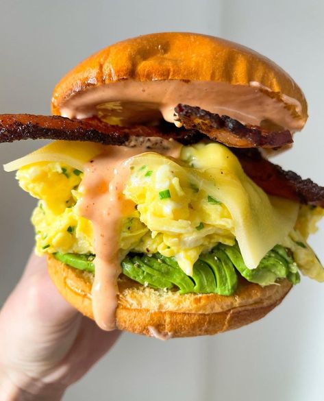 TasteToronto on Instagram: “• Make it at Home // Recipe Link in BIO • Ultimate Breakfast Sandwich: Brioche Bun / Scrambled Eggs with Chives / Cheddar Cheese / Avocado…” Bacon Egg Cheese Avocado Sandwich, Scrambled Egg Grilled Cheese Sandwich, Bacon Egg And Cheese Breakfast Sandwich, Eggs With Chives, Bacon Egg And Cheese Sandwich, Pesto Egg Bagel Sandwich, Brioche Bun, Breakfast Sandwich Recipes, Ultimate Breakfast