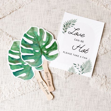 "Palm Leaf Hand Fans make a cute favor for guests at your destination beach themed wedding.  Use them to keep guests cool at your Hawaiian ceremony or as favors for your bachelorette weekend!  For a custom touch you can add CLEAR personalized labels to your order. ★DETAILS★ Listing is for 10 Palm Leaf Fans. Personalized CLEAR Labels can be added for an additional cost - make sure to send text info if you choose to add labels. Fans arrive separate from the clear labels. Some assembly required (attaching the self-stick labels to the paddle fans).  Size: 6.75\" X 7.5\" for the card; 12\" total (handle included). Material:  Laminated printed paper + Wooden Handle TROPICAL BEACH IDEAS https://www.etsy.com/shop/ModParty?ref=l2-shopheader-name&search_query=palm" Tropical Favors For Guests, Palm Fans Wedding, Destination Wedding Fans, Hawaii Theme Wedding Ideas, Tropical Beach Wedding Ideas, Tropical Wedding Favors, Tropical Wedding Aisle, Hawaiian Wedding Theme, Destination Wedding Favors For Guests