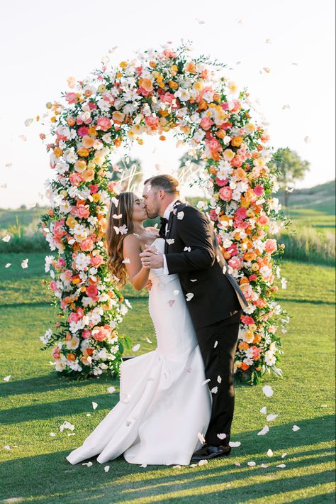 Golf course wedding, Prairie Dunes Golf Club Kansas, orange and pink flowers, wedding, yellow flowers, bright color, flower arch, colorful wedding ceremony Pink Orange White Flowers, Pink Yellow Orange Purple Wedding, Bright Wedding Flower Arch, Timeless Colorful Wedding, Red Pink Yellow Wedding, Pink And Yellow Wedding Decorations, Peach Pink Orange Wedding Flowers, Bright Pink And Orange Wedding Flowers, Pink Orange Yellow Wedding Invitations