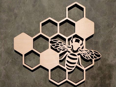 Bee Wall Décor, Honey bee Honeycomb, bee art, bumble bee, wall art Details: The Product Shown in photos is 6 in wide and has a painted black finish. Also available are 9 in wide and 12 in wide  options. The finish shown is painted black, but options to paint it or gray or have a raw wood finish are also available. Cut from quarter inch birch plywood. Note that the front face will have the desired finish, but the back side will not. Bee Wall Décor, Honey Bee Wall Art, Honeycomb Wall Hanging, Save the Bees Wall Art, Geometric Nature Wall Décor, Wooden,Bee Wall Hanging, Minimalist, Lazerfocus, lazerfocususa Bee Bathroom, Honey Bee Wall Art, Bumble Bee Wall Art, Bee Project, Cricut Leather, Bee Kitchen, Honeycomb Wall, Bee Room, Wooden Bee