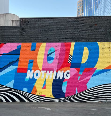 Mural on Third Avenue N, near Printers Alley in Nashville. The mural was commissioned by Audi and created in 2019 by No Kings Collective, aka Brandon Hill and Peter Chang, two Washington, D.C. artists, who are known for their use of bright, saturated colours and dynamic graphic design style. @NoKingsCollective Photograph: Zena O’Connor, April 2023 Retail Mural, Mural Advertising, Wall Typography Design, Quote Wall Mural, Wall Graphic, Type Mural, Church Mural, Corporate Wall Mural, Mural Typography