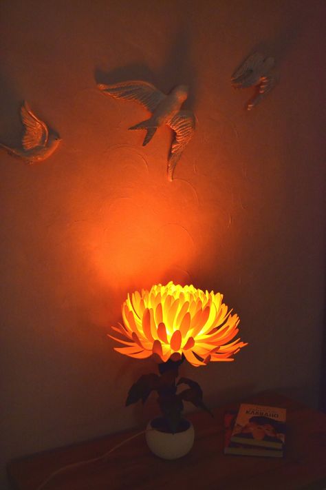 "Brigth Orange Chrysanthemum Flower LED Lamp ❤ Good for Farmhouse style.  Good for living room, bedroom, dorm or kids room. Perfect unique housewarming gift. Soft orange-red light. Made by hands from safe materials: isolon (foam material) for flower shade and leafs, metal+plastic for stem and electrical power components to make this flower shine.  The flower is in a ceramic pot. - powered by 220V. (Plug will be selected from the buyer's destination country or you can note it in your order.  By default we provide a 2 round pins plug (EU Standard 220v Electrical Wire). We will add a 2 flat pins plug for buyers from the United States, Canada and Japan) - LED-Lamp included. The flower lampshade can be removed for cleaning. Cleaning methods: ◦wipe it with a cloth ◦blow off the dust  ◦wash it wi Orange Chrysanthemum, Led Nightstand, Fall Cottagecore, Flower Lamp Shade, Cottagecore Room, Nightstand Table, Orange Lamps, Cottagecore Room Decor, Pinterest Contest