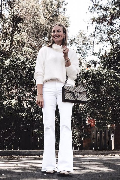 Ladies....this outfit is under $100!!!!😲 And even though this fuzzy cream sweater is affordable, it's still super soft and luxurious!☁️ And don't tell your grandmas, but we wear white year round here in SoCal!!🤫⁠   white outfit, white flare jeans, white bell bottoms, date night outfit, fall outfit, gucci purse White Flair Jeans Outfit Winter, White Flare Jeans Winter Outfit, White Flare Jeans Outfit Winter, White Flair Jeans Outfit, White Flared Jeans Outfit, White Bell Bottoms Outfit, Flair Jeans Outfit Winter, Flare Jeans Winter Outfit, White Flare Jeans Outfit