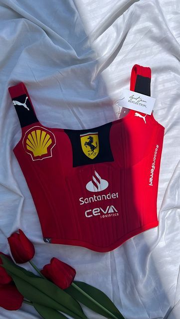 April Jean Libaton on Instagram: "Custom Ferrari corset top inspired by #16 Charles Leclerc! 🏎️ Which F1 driver would you want to see a corset inspired by next? 👀  . . . #Ferrari  #CharlesLeclerc  #F1Fashion  #AprilJeanReflection  #CustomCorset  #FerrariStyle  #f1fashionista  #F1Fashion #FerrariFans #CharlesLeclerc #F1Style #FerrariCorset #CustomClothing #MotorsportFashion #Formula1Merch #HandmadeFashion #racedaystyle" Ferrari Corset, F1 Merch Aesthetic, Ferrari Clothes, Ferrari F1 Aesthetic, F1 Fits, Ferrari Merch, Formula 1 Merch, Custom Ferrari, Ferrari Fashion