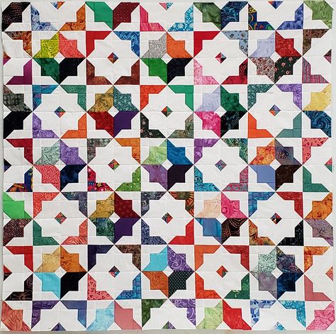 This is a disappearing hourglass variation I call Moroccan Tiles. The pattern is available free in my newsletter. Quilters Cache Quilt Block Patterns, Triangle Jitters Quilt, Disappearing Hourglass Quilt Block, Accuquilt Qube Block Patterns, Brita Nelson The Questioning Quilter, Tiled Quilt, Layer Cake Quilts, Nine Patch Quilt, Geometric Quilt