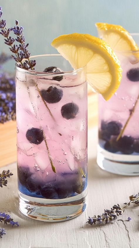 We’re taking a cocktail classic to the next level with this Blueberry Tom Collins. It’s the same Tom Collins you know and love, but bluetified with a quick Lavender Blueberry Cocktail, Lavender Gin And Tonic, Uses For Lavender Syrup, Botanical Drinks, Lavender Soda, Lavender Drinks, Lavender Collins, Drink Flavors, Lavender Ideas