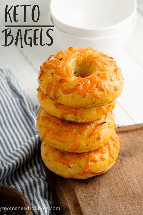 This keto bagels recipe is a variation of the popular fathead dough recipe - using olive oil instead of cream cheese! They are chewy, delicious, easy to make, and are ready in less than an hour! We topped them with cheddar cheese, but the topping possibilities are endless! #ketorecipes #ketobaking #ketoliving #glutenfree #healthyliving #almondflour Calic Bagel Recipe, Cheddar Bagel Recipe, Best Keto Bagel Recipe, Keto Bagels Recipe, Keto Friendly Bagels, Low Carb Everything Bagel Recipe, Kept Bagels, Cheddar Bagels, Types Of Bagels