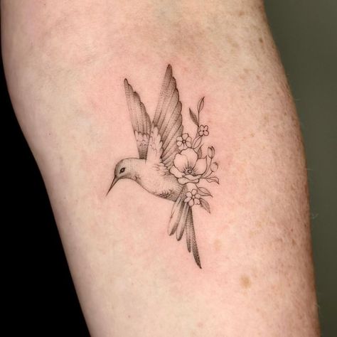 Tiny Tattoos Hummingbird, Humming Bird With Flower Tattoo, Hummingbird Holding Flower Tattoo, Hummingbird And Carnation Tattoo, Unique Hummingbird Tattoo, Hummingbird Floral Tattoo, Hummingbird Hand Tattoo, Hummingbird Memorial Tattoo, Hummingbird Wrist Tattoo