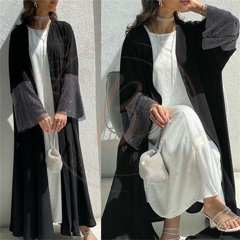 Elevate your modest wardrobe with our exquisite Moroccan Gulf Women's Black Open Kimono Abaya 🖤. Perfect for Muslim Ramadan Eid celebrations, this elegant ensemble features an elastic drilling net shalwar kameez for added comfort and style. Crafted with care, our casual loose robe embodies the essence of Moroccan Gulf fashion, offering a blend of tradition and contemporary flair. Whether you're attending festive gatherings or seeking everyday modest wear, our versatile attire promises a gracefu Abaya Kimono, Winter Typ, Black Kimono, Kimono Cardigan, Kaftan Dress, Long Sleeve Maxi, Muslim Women, Cardigan Coat, Kebaya