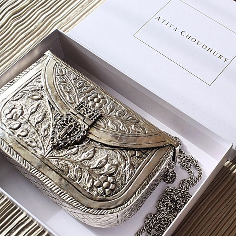 AMIRA (Silver Brass Clutch) - Back in stock!  Exclusive to our brand – A handcrafted brass clutch with the most intricate details. The… Bridal Handbags, Potli Bags, Wedding Gifts For Bride, Designer Clutch, Unique Gifts For Her, Gold Jewellery Design, Back In Stock, Stylish Bag, Vintage Look