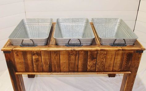 This galvanized beverage tub with stand makes for an attractive beverage and ice bucket at your wedding or event. Our clients love using each of the three metal drink tubs for different beverages. In addition, the rustic wood stand is a stylish addition to your party’s theme. | Wood N Crate Rentals #arizonawedding #modernwedding #mesawedding #weddingrentals #rusticwedding Wedding Beer Cooler Ideas, Drink Trough Wedding, Beverage Tub Ideas, Buffet Table Arrangement, Drink Tub, Wedding Dessert Table Decor, Lakefront Wedding, Wooden Cooler, Barrel Ideas