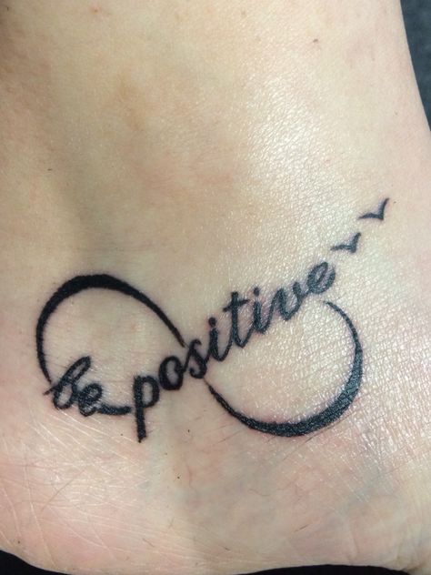 Be Positive Tattoo Symbol, Be Positive Tattoo, Positivity Tattoos, Little Cross Tattoos, Shoulder Piece Tattoo, Positivity Tattoo, Positive Symbols, Small Cross Tattoos, Small Foot Tattoos