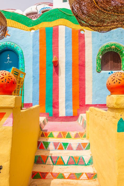 The most colorful village in Egypt!! Can you believe this is a real place?? Here's everything you need to know about visiting Nubia, the incredible Nubian Village near Aswan, Egypt. #nubia #aswan #egypt #map #village #nuba #colorful #rainbow #stairs #steps #instagram Nubian Village, Trip To Egypt, Aswan Egypt, Kitsch Decor, Hijau Mint, Egyptian Inspired, Pintura Exterior, Colorful Places, Colourful Buildings