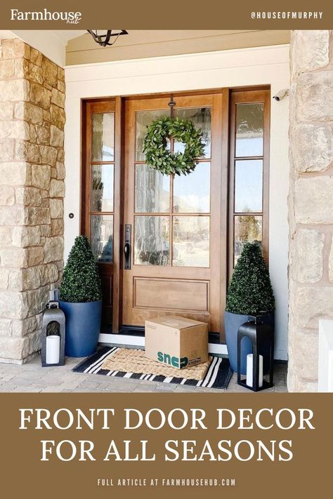 Glass entry door with decor Coastal Wood Front Door, Wood Front Door With Glass, Golden Oak Front Door, Exterior Door Decor, Year Round Porch Decor, Natural Front Door, Front Door With Glass Window, Year Round Front Porch Decor, Front Porch Plants Year Round