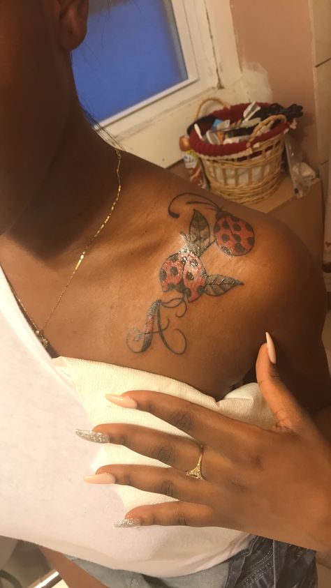 Behind The Shoulder Tattoos For Women, Ladybug Tattoos For Women, Ladybug Tattoo Ideas Black, Tattoos For Black Skin Women, Spine Tattoos Women, Cute Shoulder Tattoos For Black Women, Ladybugs Tattoo, Tattoos Dark Skin, Ladybug Tattoo Ideas