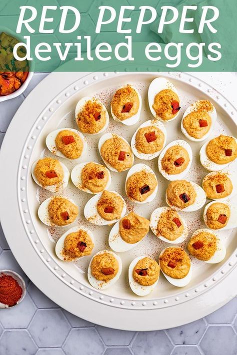 These roasted red pepper deviled eggs are a delightful twist on the classic. The red pepper gives the filling a smoky, slightly sweet flavor. #eggs #eggrecipes #deviledeggs #hardboiledeggs #esterrecipes #easterappetizers #appetizers #instantpotrecipes #robustrecipes Red Pepper Deviled Eggs, Roasted Red Pepper Deviled Eggs, Cooking Hard Boiled Eggs, Roasted Red Pepper Dip, Making Hard Boiled Eggs, Deviled Eggs Easy, Roasted Red Pepper Hummus, Easter Appetizers, Classic Appetizers